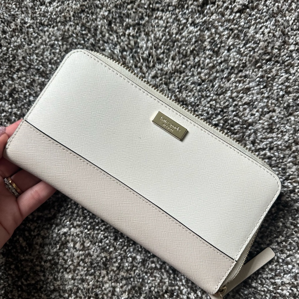 Kate Spade Cream Wallet with Gold Accents and Structured Design